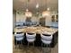 Bright kitchen island featuring white cabinetry, stainless steel appliances, and an island with stone countertops at 15135 E Sundown Dr, Fountain Hills, AZ 85268