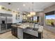 Spacious kitchen with granite countertops, stainless steel appliances, and a large center island with a prep sink at 15135 E Sundown Dr, Fountain Hills, AZ 85268