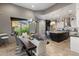 Kitchen featuring island with seating, modern lighting and mountain views at 15135 E Sundown Dr, Fountain Hills, AZ 85268