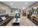 Cozy living room featuring dark leather furniture and a built-in bar area, perfect for entertaining guests at 15135 E Sundown Dr, Fountain Hills, AZ 85268
