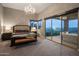 Large main bedroom suite with plush carpet, outside views, and elegant chandelier at 15135 E Sundown Dr, Fountain Hills, AZ 85268