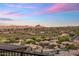 Scenic view of the surrounding neighborhood and mountains with a colorful sky backdrop at 15135 E Sundown Dr, Fountain Hills, AZ 85268