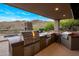 Modern outdoor grill area features stainless steel appliances and countertop space, ideal for outdoor cooking with scenic views at 15135 E Sundown Dr, Fountain Hills, AZ 85268