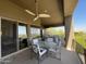 Outdoor patio area with a ceiling fan, dining table, and chairs, perfect for relaxing and enjoying the view at 15135 E Sundown Dr, Fountain Hills, AZ 85268