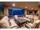 Inviting covered patio boasts comfortable seating, a fire pit, and scenic mountain views, perfect for outdoor relaxation at 15135 E Sundown Dr, Fountain Hills, AZ 85268