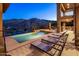 Stunning pool area features lounge chairs, a built-in grill, and breathtaking mountain vistas, creating a luxurious outdoor experience at 15135 E Sundown Dr, Fountain Hills, AZ 85268