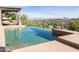 Stunning infinity pool overlooking picturesque desert landscape with distant mountain views at 15135 E Sundown Dr, Fountain Hills, AZ 85268