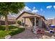 Enjoyable backyard featuring a covered patio, low-maintenance turf, and desert-friendly landscaping at 15633 W Acapulco Ln, Surprise, AZ 85379