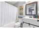 Cozy bathroom with a shower-tub combo, modern vanity, and stylish decor accents, for an inviting and practical space at 15633 W Acapulco Ln, Surprise, AZ 85379
