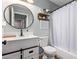 Fresh bathroom featuring modern fixtures, a sleek vanity, and a shower-tub combo, combining style and functionality at 15633 W Acapulco Ln, Surprise, AZ 85379