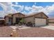 Charming single-Gathering home with low maintenance desert landscaping, and a 2-car garage at 15633 W Acapulco Ln, Surprise, AZ 85379