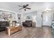 Well-lit living room features hardwood floors, neutral colors, and comfortable seating at 15633 W Acapulco Ln, Surprise, AZ 85379