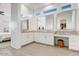 Bright bathroom featuring double sinks with granite countertops and contemporary cabinetry at 16566 W Saguaro Park Ln, Surprise, AZ 85387