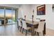 Elegant dining room with seating for six, perfect for hosting intimate gatherings at 16566 W Saguaro Park Ln, Surprise, AZ 85387
