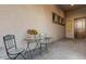 Cozy patio with seating area for relaxing and enjoying the outdoors at 16566 W Saguaro Park Ln, Surprise, AZ 85387