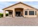 View of the covered patio and low-maintenance desert landscaping in the backyard at 17132 E Hillcrest Dr, Fountain Hills, AZ 85268
