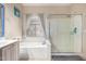 This bathroom features both a bathtub and shower with a nearby window for natural lighting at 17132 E Hillcrest Dr, Fountain Hills, AZ 85268