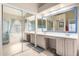 This primary bathroom features a dual sink vanity with a large mirror and separate bathtub and shower at 17132 E Hillcrest Dr, Fountain Hills, AZ 85268
