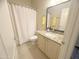 Cozy bathroom featuring a shower-tub combo, white vanity and great light at 17132 E Hillcrest Dr, Fountain Hills, AZ 85268