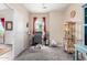 A bedroom featuring a desk, carpet flooring, and a window with red curtains and a view of the desert at 17132 E Hillcrest Dr, Fountain Hills, AZ 85268