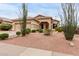 Inviting single-level home with a desert landscaped front yard, complemented by native plants and a two-car garage at 17132 E Hillcrest Dr, Fountain Hills, AZ 85268