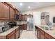 Spacious kitchen featuring granite countertops, stainless appliances, and a breakfast nook area at 17132 E Hillcrest Dr, Fountain Hills, AZ 85268