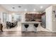 Open kitchen showcasing granite countertops, stainless appliances, and a breakfast bar with bar stools at 17132 E Hillcrest Dr, Fountain Hills, AZ 85268