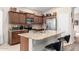 Well-equipped kitchen with granite countertops, stainless appliances, and dark wood cabinets at 17132 E Hillcrest Dr, Fountain Hills, AZ 85268