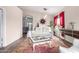 Stylishly decorated living room with white sofa set, colorful rug, and view into connecting rooms at 17132 E Hillcrest Dr, Fountain Hills, AZ 85268