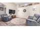 Cozy living room featuring comfortable gray seating, stylish rug, and decorative accents at 17132 E Hillcrest Dr, Fountain Hills, AZ 85268
