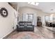 Bright living room with high ceilings, a skylight, and a comfortable gray sofa at 17132 E Hillcrest Dr, Fountain Hills, AZ 85268