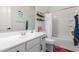 Well-lit bathroom with a white vanity, framed mirror, and shower-tub combination with a sleek design at 18422 W Clinton St, Surprise, AZ 85388