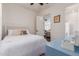Inviting bedroom with soft hues, stylish furniture, and an en-suite bathroom access at 18422 W Clinton St, Surprise, AZ 85388
