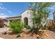 Charming single-story home featuring a two-car garage and a well-maintained, drought-resistant landscaped front yard at 18422 W Clinton St, Surprise, AZ 85388