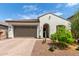 Charming single-story home featuring a two-car garage and a well-maintained, drought-resistant landscaped front yard at 18422 W Clinton St, Surprise, AZ 85388