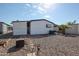 Backyard with rock landscaping and a palm tree at 205 S Higley Rd # 286, Mesa, AZ 85206