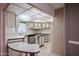 Well-lit kitchen features white cabinets, black counters, and breakfast bar at 205 S Higley Rd # 286, Mesa, AZ 85206
