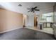 Cozy living room featuring neutral carpet and an open archway to the kitchen at 205 S Higley Rd # 286, Mesa, AZ 85206