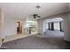 Inviting living room featuring gray walls, neutral carpet and an open archway to a separate living space at 205 S Higley Rd # 286, Mesa, AZ 85206