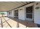 This covered patio with tile floor, and decorative welcome sign creates a perfect entry point at 205 S Higley Rd # 286, Mesa, AZ 85206