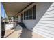 Cozy covered porch with tile, and steps for outdoor lounging or easy access to a yard area at 205 S Higley Rd # 286, Mesa, AZ 85206