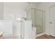 Roll-in shower with glass door and accessible fixtures at 2140 S Benton Cir, Mesa, AZ 85209
