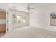 A bright primary bedroom has an attached space that could function as an office at 2140 S Benton Cir, Mesa, AZ 85209