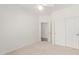Bright bedroom features neutral carpet and closet with panel doors at 2140 S Benton Cir, Mesa, AZ 85209