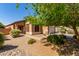 Inviting single-Gathering home with desert landscaping, a two-car garage, and a covered front entry at 2140 S Benton Cir, Mesa, AZ 85209