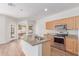 Bright kitchen featuring an island, stainless steel appliances, and granite countertops at 2140 S Benton Cir, Mesa, AZ 85209