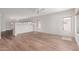 Open-concept living area featuring hardwood floors, neutral paint, and natural light at 2140 S Benton Cir, Mesa, AZ 85209