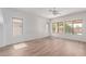 Spacious room boasting hardwood floors, neutral colors, and natural light from the windows at 2140 S Benton Cir, Mesa, AZ 85209