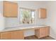 Functional office space featuring granite countertop and wood cabinetry at 2140 S Benton Cir, Mesa, AZ 85209
