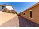 Side yard features desert landscaping and block fence for privacy at 2140 S Benton Cir, Mesa, AZ 85209
